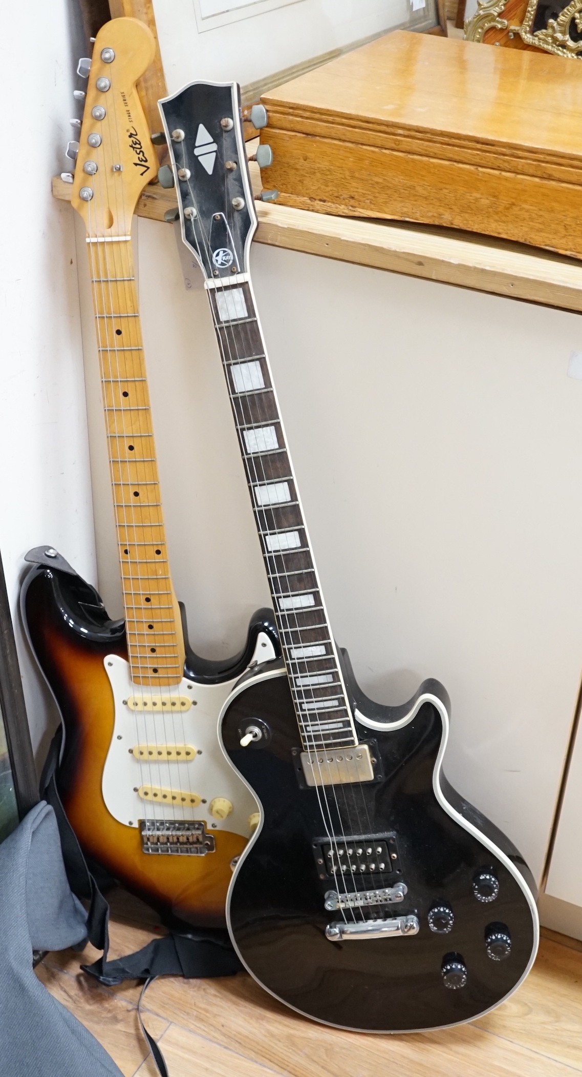 Two electric guitars: a Kay and a Vester Stage series, one soft case